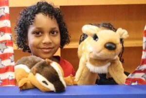 Girl playing with puppets